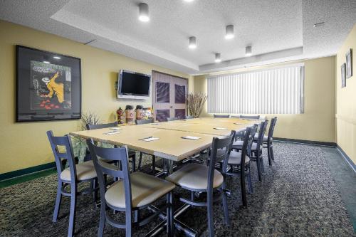 a large conference room with a long table and chairs at AmericInn by Wyndham Sioux Falls in Sioux Falls
