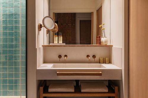 a bathroom with a sink and a mirror at ME by Meliá Malaga in Málaga