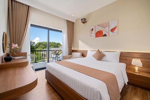 a bedroom with a large bed and a large window at RubyHome in Thôn Nguyệt Biều
