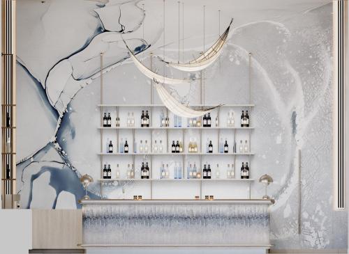 a room with a shelf of glass bottles at Meliá Aurea Nha Trang in Nha Trang