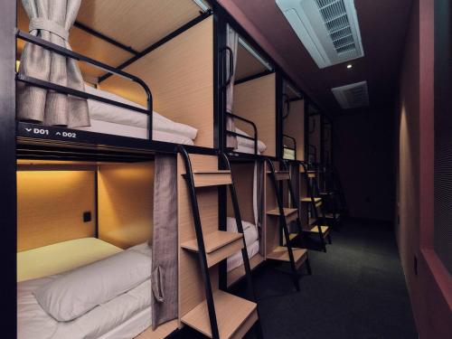 a group of bunk beds in a room at Seoul ABC Hostel in Seoul