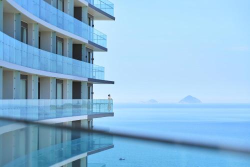 a building with a view of the water at Hyatt Regency Nha Trang in Nha Trang