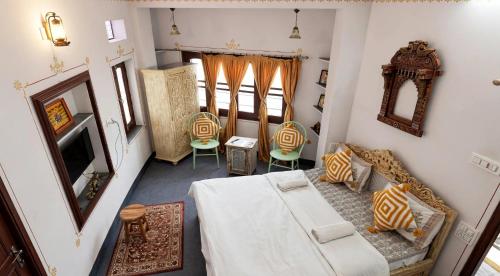 an overhead view of a living room with a table and chairs at Raahi Backpacker's Hostel- Lake View in Udaipur