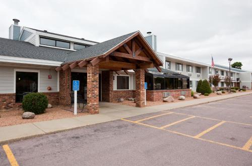 a parking lot in front of a hotel at AmericInn by Wyndham St. Peter in Saint Peter