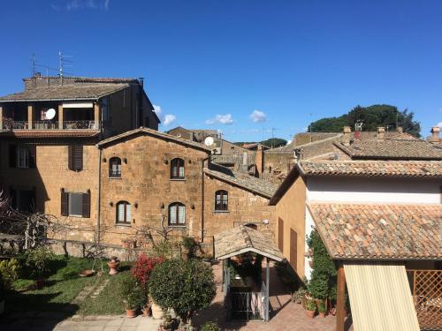 a group of buildings in a medieval town at Atmosfera d'Arte - Private parking in Orvieto