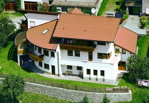 a large white house with a red roof at Apart Franziska in Kauns