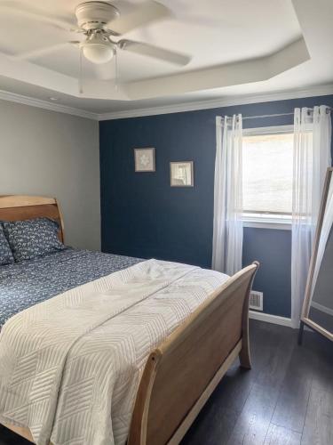 a bedroom with a bed and a ceiling fan at Tucked away in Tucker in Tucker