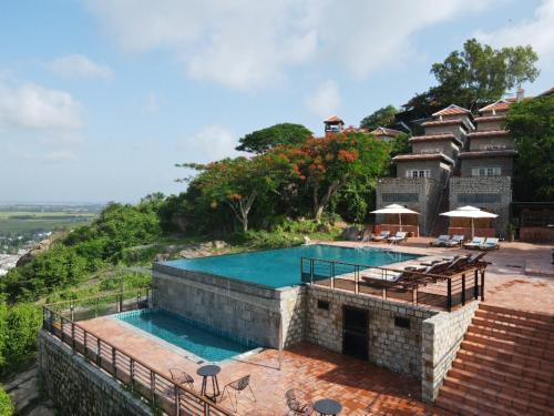 an image of a house with a swimming pool at Victoria Nui Sam Lodge in Chau Doc