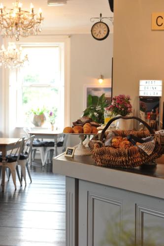 a kitchen with a counter with a basket of bread at The Gateway Lodge in Donegal