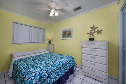 a bedroom with a bed and a ceiling fan at Oceanfront 1BR • Top-Floor Balcony Views • Cherry Grove • Sea Cabin 304-A in Myrtle Beach