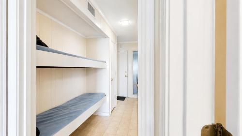 a hallway with a bunk bed in a house at Oceanfront 1BR • Updated Balcony • Cherry Grove • Sea Cabin 206-A in Myrtle Beach