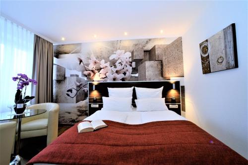 Postel nebo postele na pokoji v ubytování Ascot Hotel