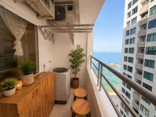 a balcony with a view of the ocean at Sea View Apartment Muong Thanh Oceanus Nha Trang in Nha Trang