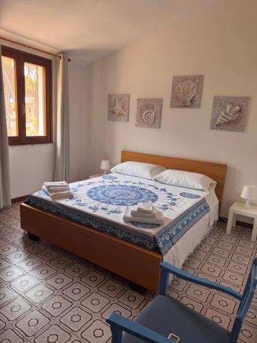 a bedroom with a bed and a chair in it at Al Mare Home in Pula