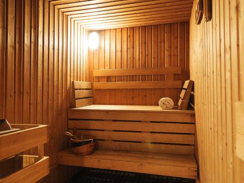 a sauna with a bench in a wooden room at Aparthotel Adagio Marseille Timone in Marseille