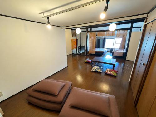 a living room with a couch and a table at CHELSEA24 in Kyoto