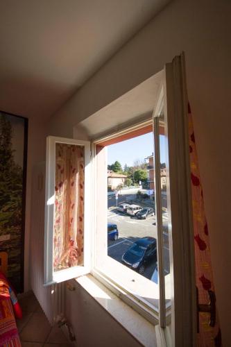 a window in a room with a view of a street at Bed & Breakfast Porta Santi in Cesena