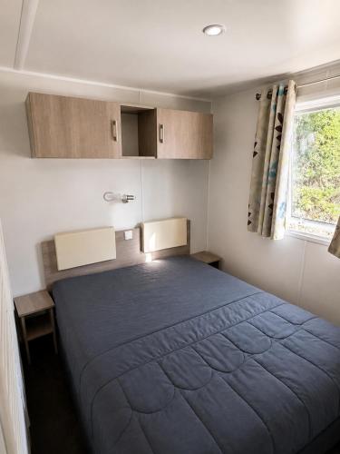 a bedroom with a large bed in a room at Le Cocon de Galaure in Châteauneuf-de-Galaure
