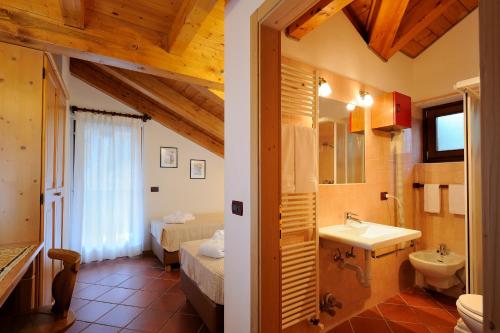 a bathroom with a sink and a toilet at Chalet dei Pini in Madonna di Campiglio