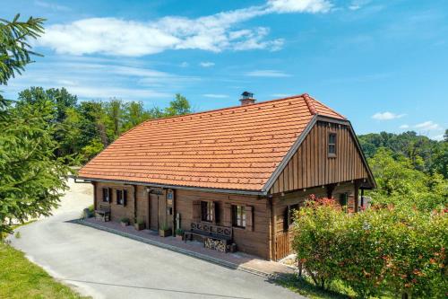 a small house with an orange roof on a road at Country home Lagom in Zagorska Sela