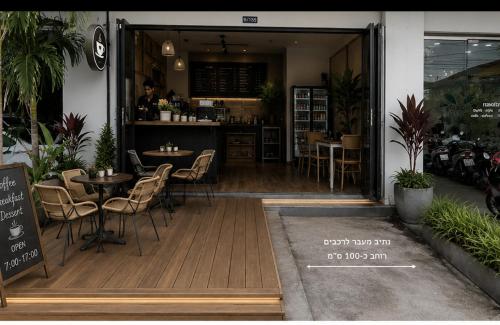 a restaurant with tables and chairs in front of it at Chu-Cha's Samui - Boutique stay in Bophut