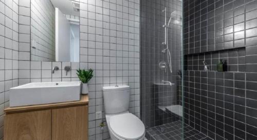 a bathroom with a toilet and a sink and a shower at base-WENDING Service Apartment-Shanghai Xujiahui Location in Shanghai