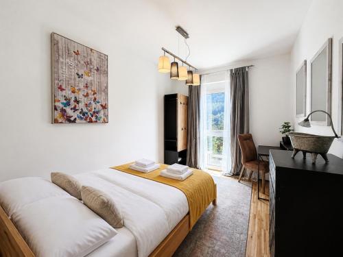 a bedroom with a large bed in a room at Bergzauber am Semmering in Semmering