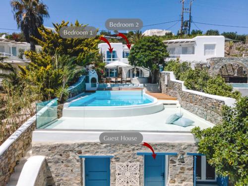 a villa with a pool and a guest house at Zegna Pool Villa, Three Bedrooms in Mikonos