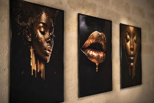four framed pictures of a woman on a wall at Aphrodeseum Romantic Suite in Taranto