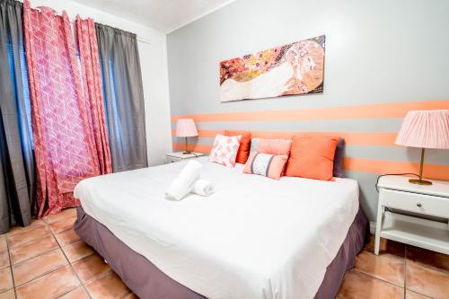 Ένα ή περισσότερα κρεβάτια σε δωμάτιο στο Ocean walk apartments