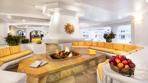 a living room with a couch and a fireplace at Sonnenalp in Vail
