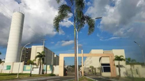 a palm tree in front of a factory at Apartamento na Região do Grande Dirceu in Teresina