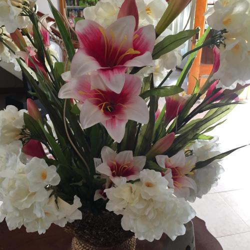 a bouquet of white and pink flowers in a vase at Rayon Hotel in Negril