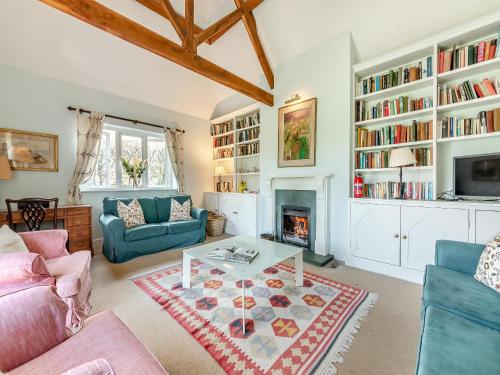 a living room filled with furniture and a fireplace at The Fishing Lodge in Amesbury