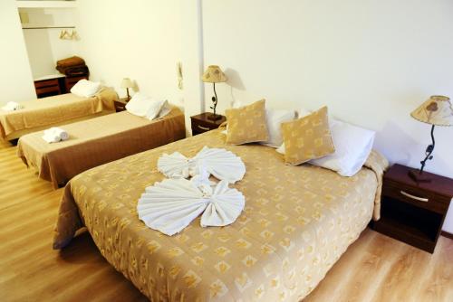 Una cama o camas en una habitación de Hotel Interlac