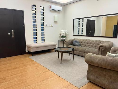 a living room with a couch and a table at Suzys homestay in Kuantan