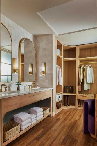 a bathroom with a sink and a mirror at Virgin Hotels Dallas in Dallas
