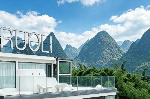 a house with a view of mountains at Ruoli Yangshuo in Yangshuo