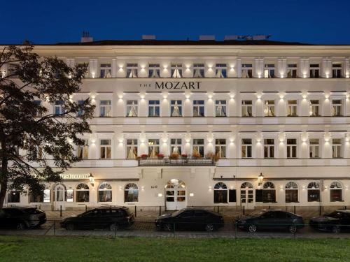 a large white building with a sign on it at The Mozart Prague in Prague