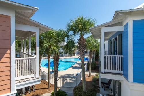 a view of the pool from the balcony of a house at Bungalows at Seagrove #138 in Seagrove Beach