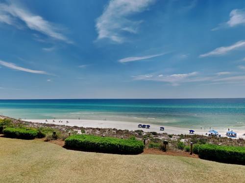 a view of a beach with umbrellas and the ocean at Adagio #203A in Santa Rosa Beach