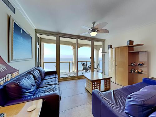 a living room with a couch and a table at Portofino Island Resort #2-1608 in Pensacola Beach