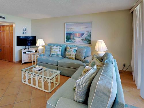 a living room with a couch and a tv at Santa Rosa Dunes #952 in Pensacola Beach