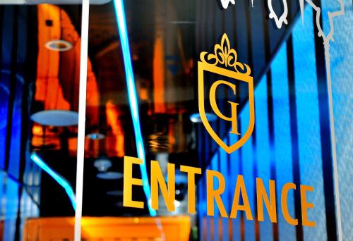 a sign on the window of a store with the words entrance at Spa&Capsule Hotel Grandpark Inn Kitasenju in Tokyo
