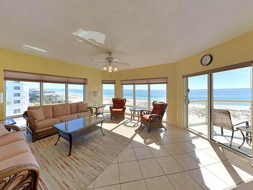 a living room with a couch and a table at Emerald Isle #401 in Pensacola Beach