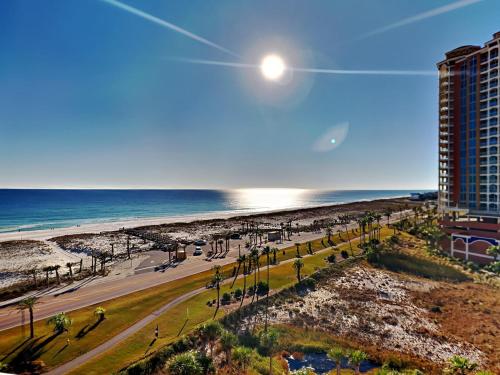 a view of the beach from the balcony of a building at Portofino Island Resort #1-702 in Pensacola Beach