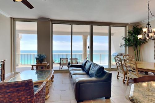 a living room with a couch and a table at Beach Club #1804C in Pensacola Beach