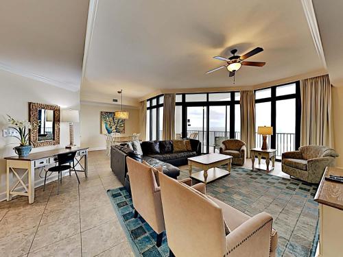 a living room with a couch and a table at Phoenix West II #2109 in Orange Beach