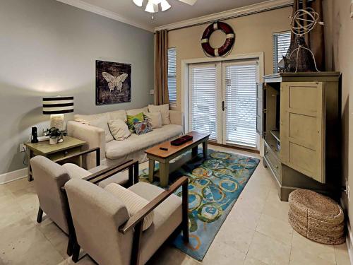a living room with a couch and a table at Seagrove Highlands #2104 in Santa Rosa Beach
