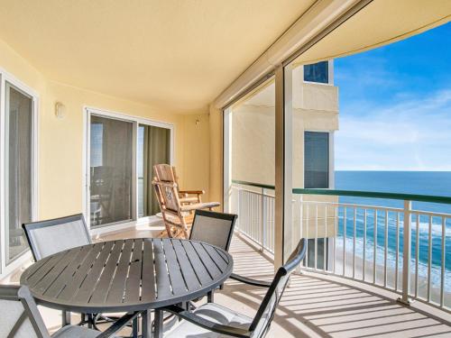 a balcony with a table and chairs and the ocean at Beach Colony Towers #15C in Perdido Key